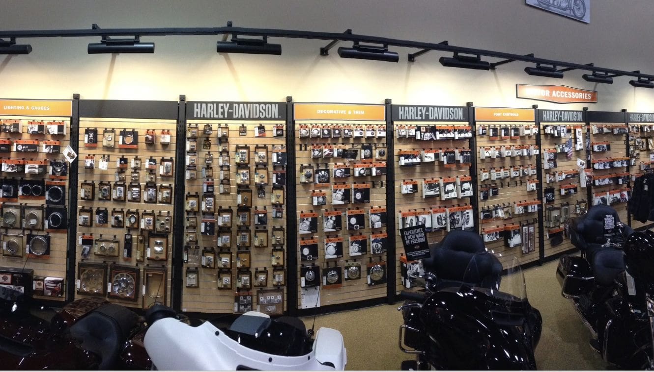 A motorcycle shop with many different types of helmets.